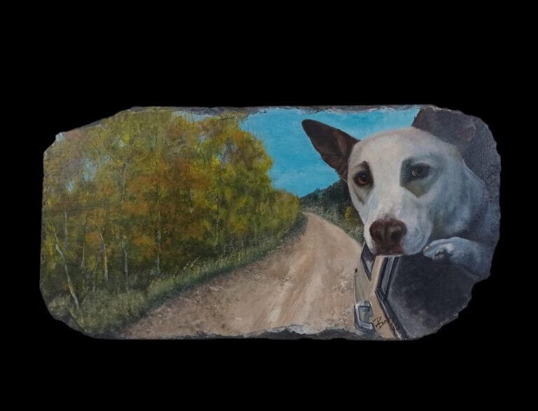 Portrait of a white dog leaning out of a car window, painted on a weathered slate shingle. The dog’s gaze meets the viewer with quiet joy as the car winds down a forested dirt road under a clear blue sky. Autumn foliage glows along the roadside, echoing the warmth of the moment. The aged slate carries the texture of time, grounding the scene in memory, movement, and companionship.
